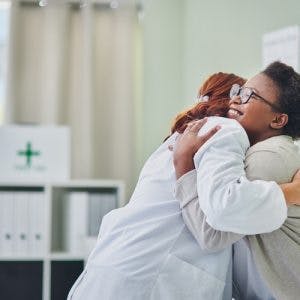 doctor and stroke patient hugging
