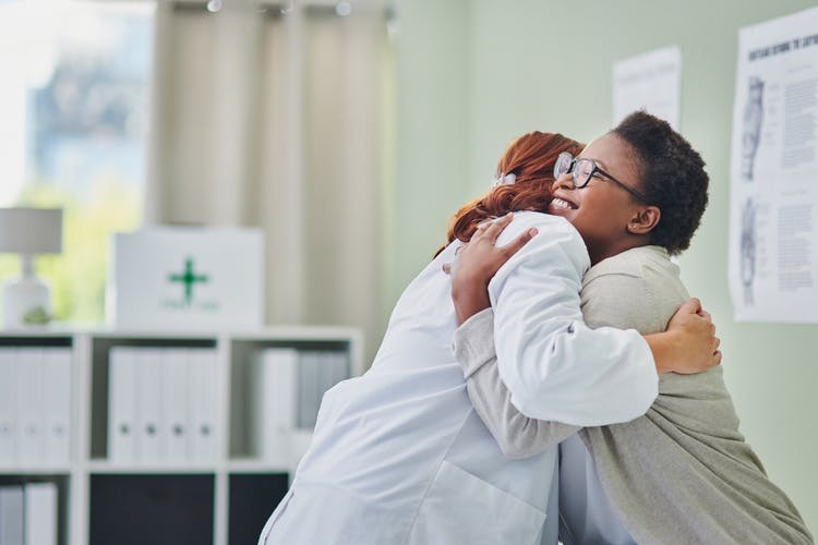 doctor and stroke patient hugging