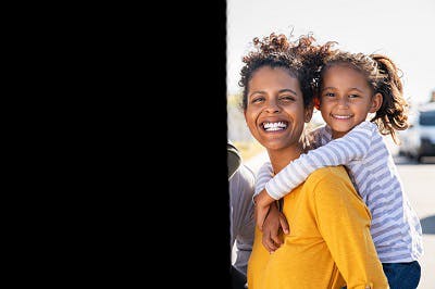 family portrait with the left half blacked out to illustrate left hemianopia after stroke, a common vision problem