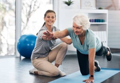 therapist doing balance exercises to help a cerebellum brain damage survivor overcome apraxia