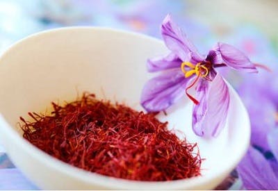 bowl of red saffron, which appears to have a thin, thread-like texture