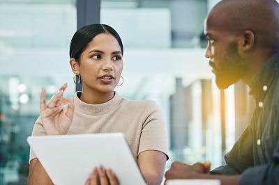 woman explaining to friend the different types of aphasia after brain injury