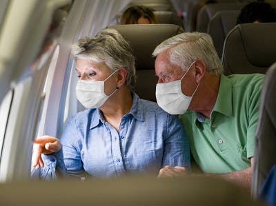husband accompanying his wife on a flight after brain injury