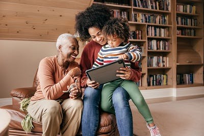 caregiver happily explaining to her loved one what to expect after brain injury