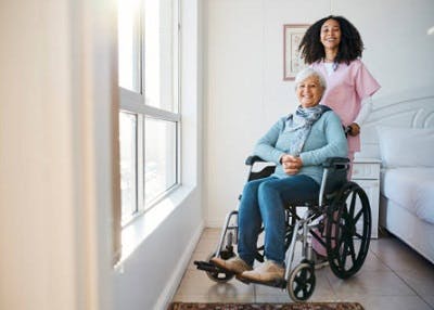caregiver helping survivor with spinal cord injury exercises
