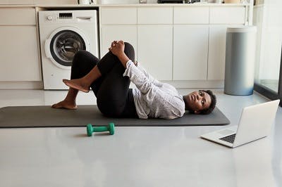 woman doing a leg exercise from her home exercise program for TBI routine
