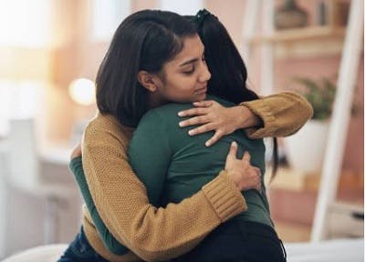 woman comforting survivor who felt panic from experiencing seizures after head injury