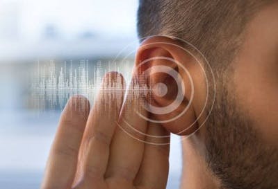 sound waves coming out of survivor's ear to illustrate tinnitus after head injury