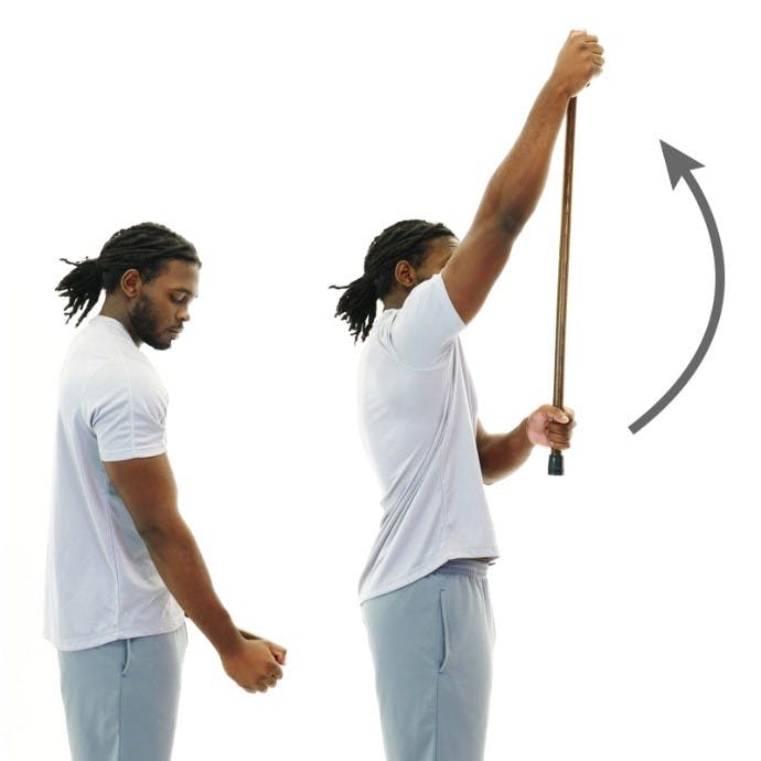 man holding cane and lifting his arm overhead for this upper extremity exercise for spinal cord injury