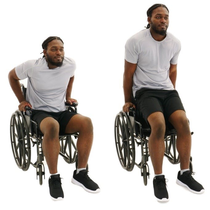 man sitting in wheelchair and lifting himself up with his triceps