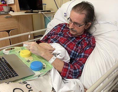 stroke survivor using FitMi from their hospital bed