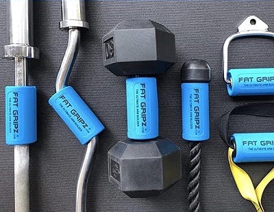 dumbbells and other physical therapy tools with thick grips to help make lifting easier during rehab