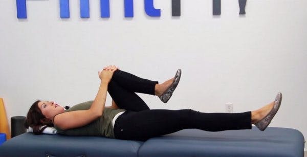 Knees to chest core exercise to promote movement after stroke.