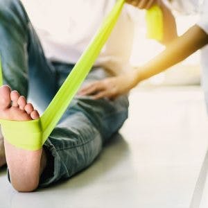 individual showing positive signs of healing foot drop while stretching