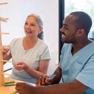 occupational therapist for stroke helping a woman recover