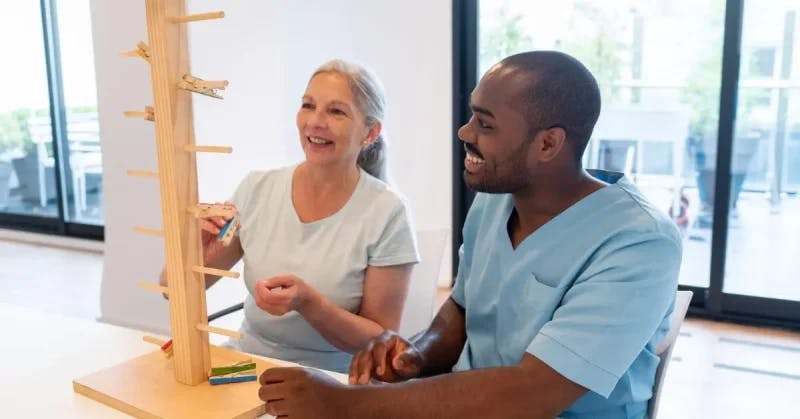 occupational therapist for stroke helping a woman recover