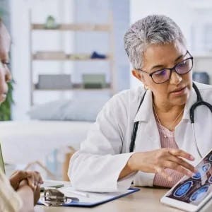 doctor explaining hypoxic brain injury to a patient