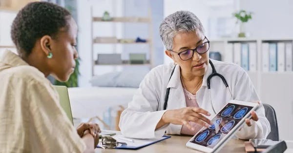 doctor explaining hypoxic brain injury to a patient