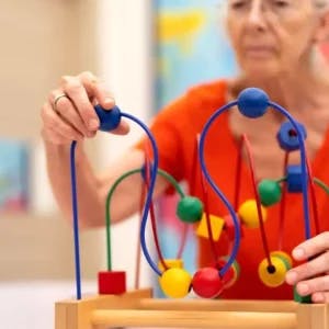 older woman doing brain exercises after stroke