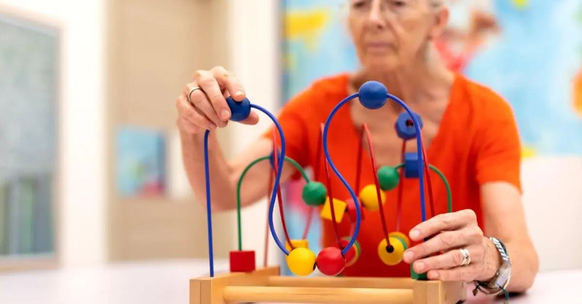 older woman doing brain exercises after stroke